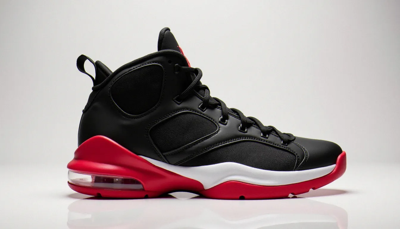 Paire de Jordan Retro 9 coloris noir et rouge vue de profil sur fond blanc, mettant en valeur la tige haute et l'amorti Air visible